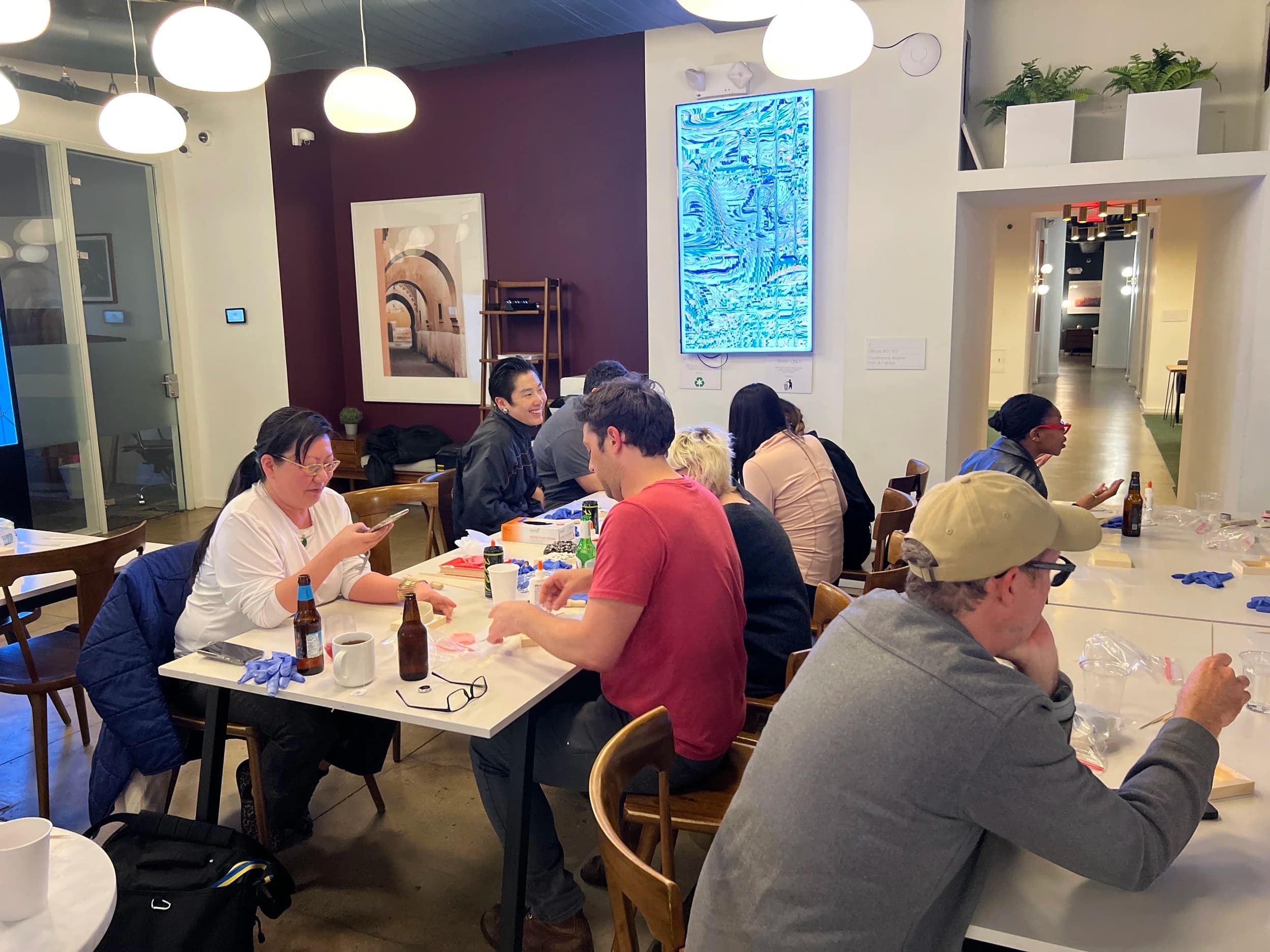 A group making art in clay together at Station3
