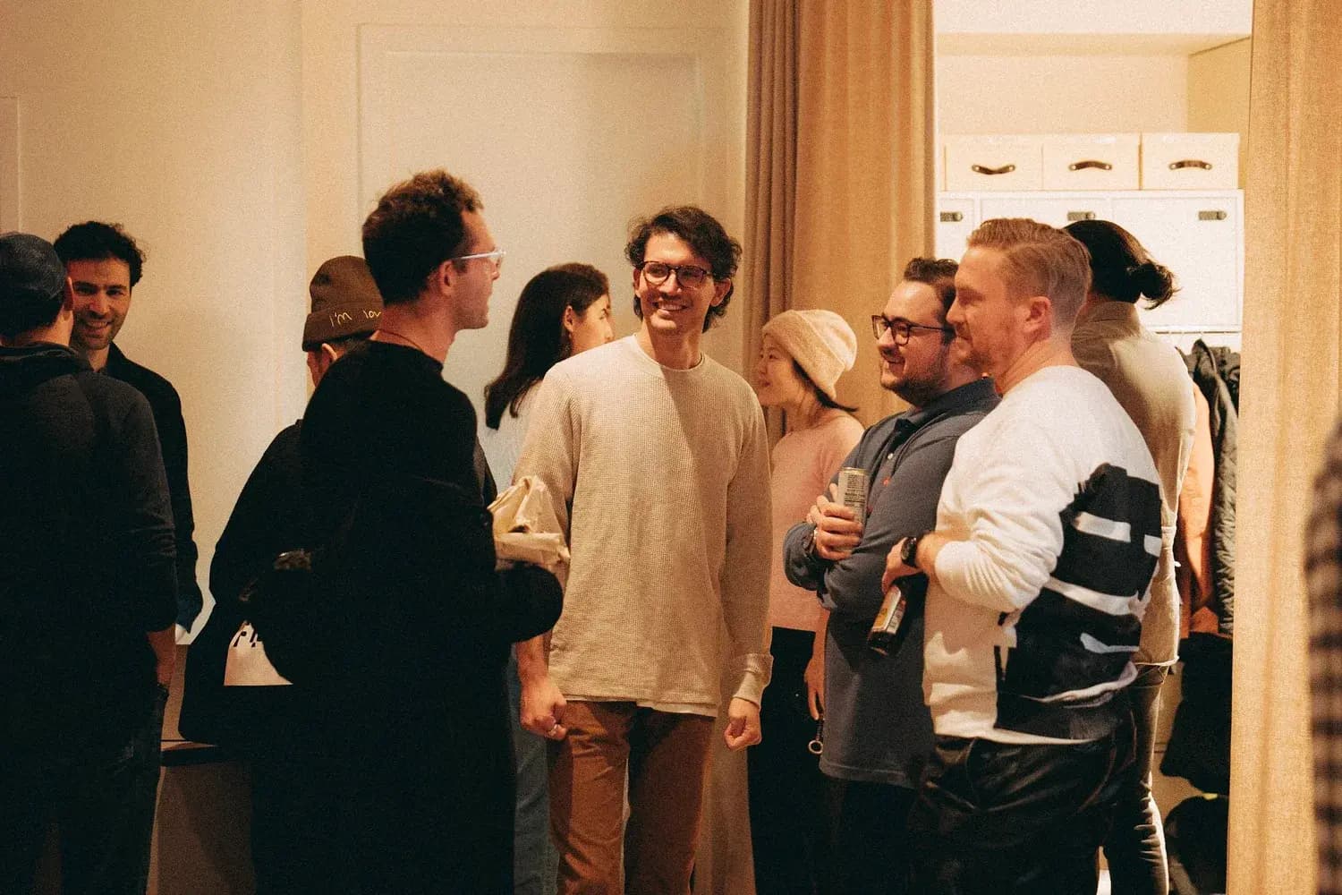 Artists and guests gathered in conversation